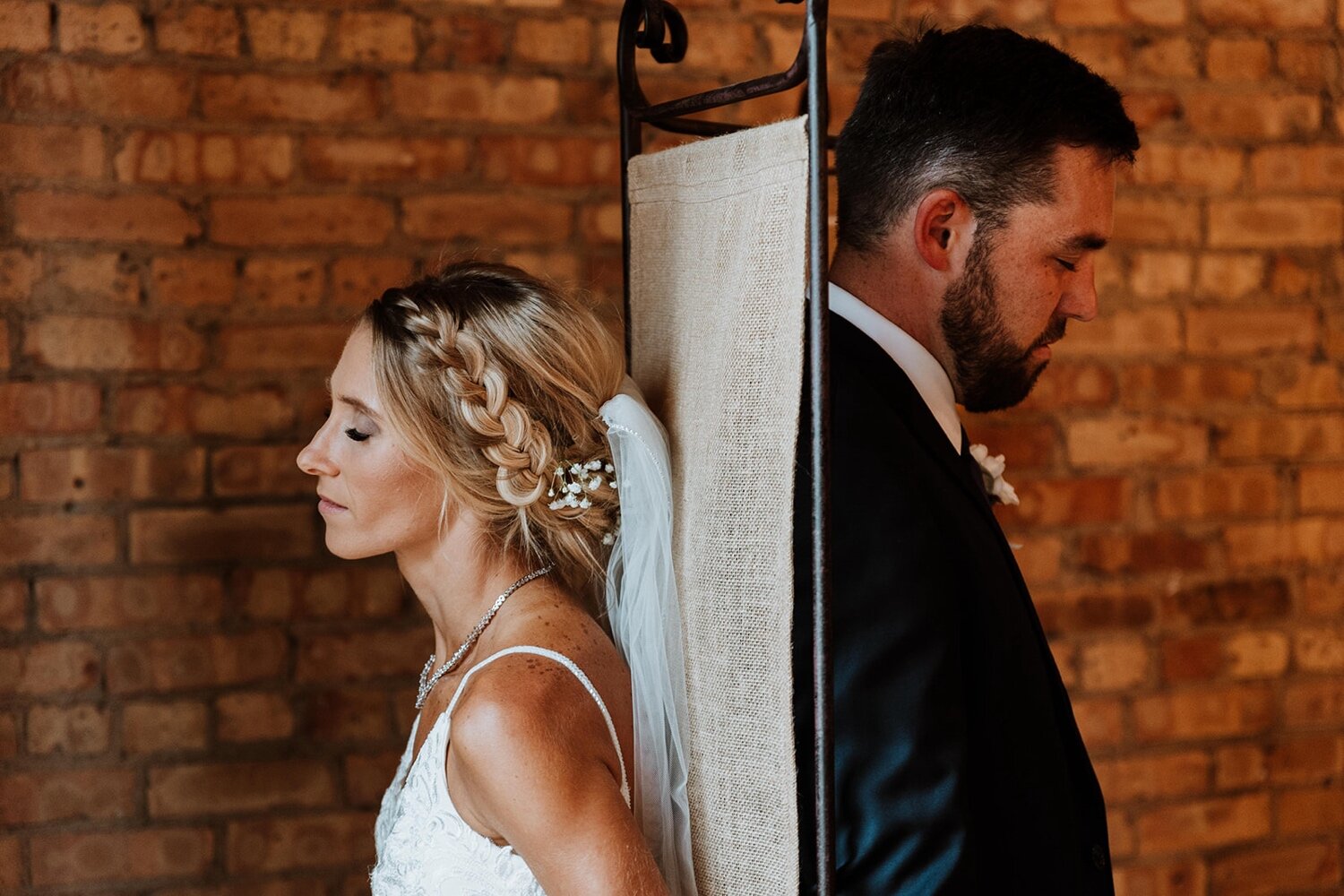 bride and groom have a first touch on their wedding day