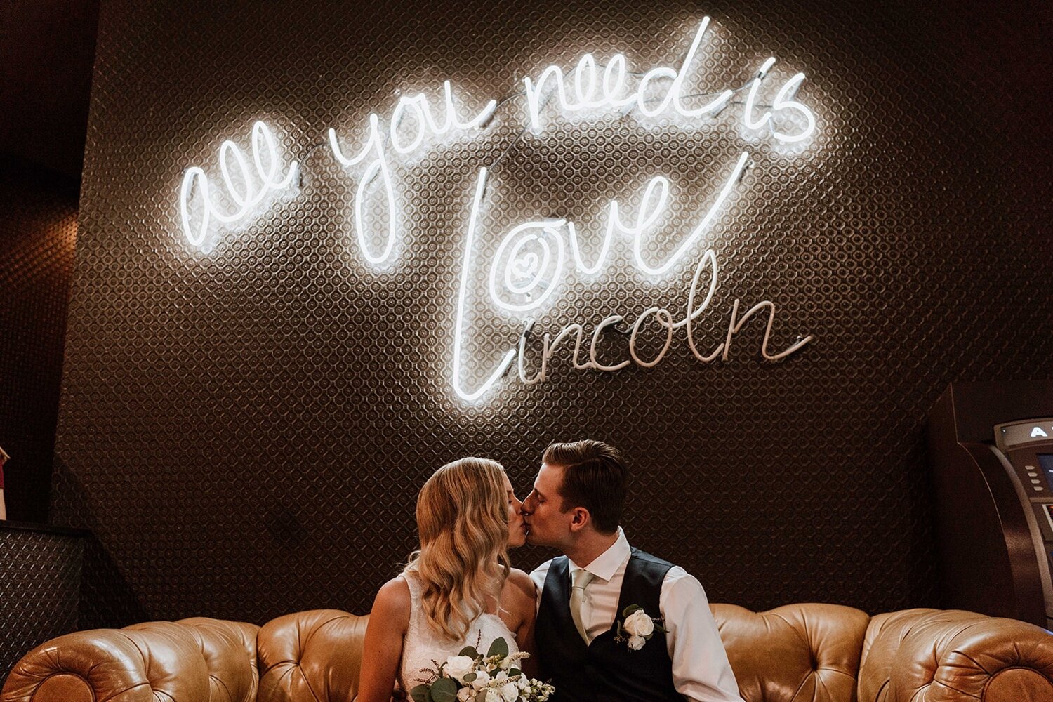 Bride and groom share intimate moment getting ready for Chicago elopement