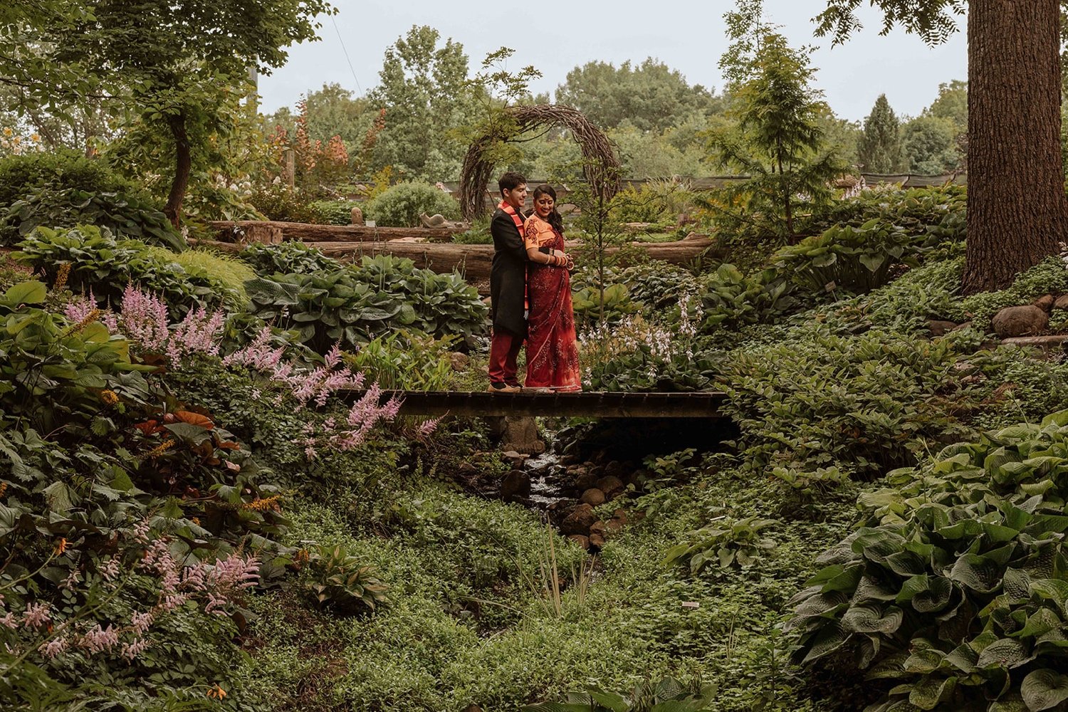 Bride and groom taking wedding day portraits at Hornbakers Gardens