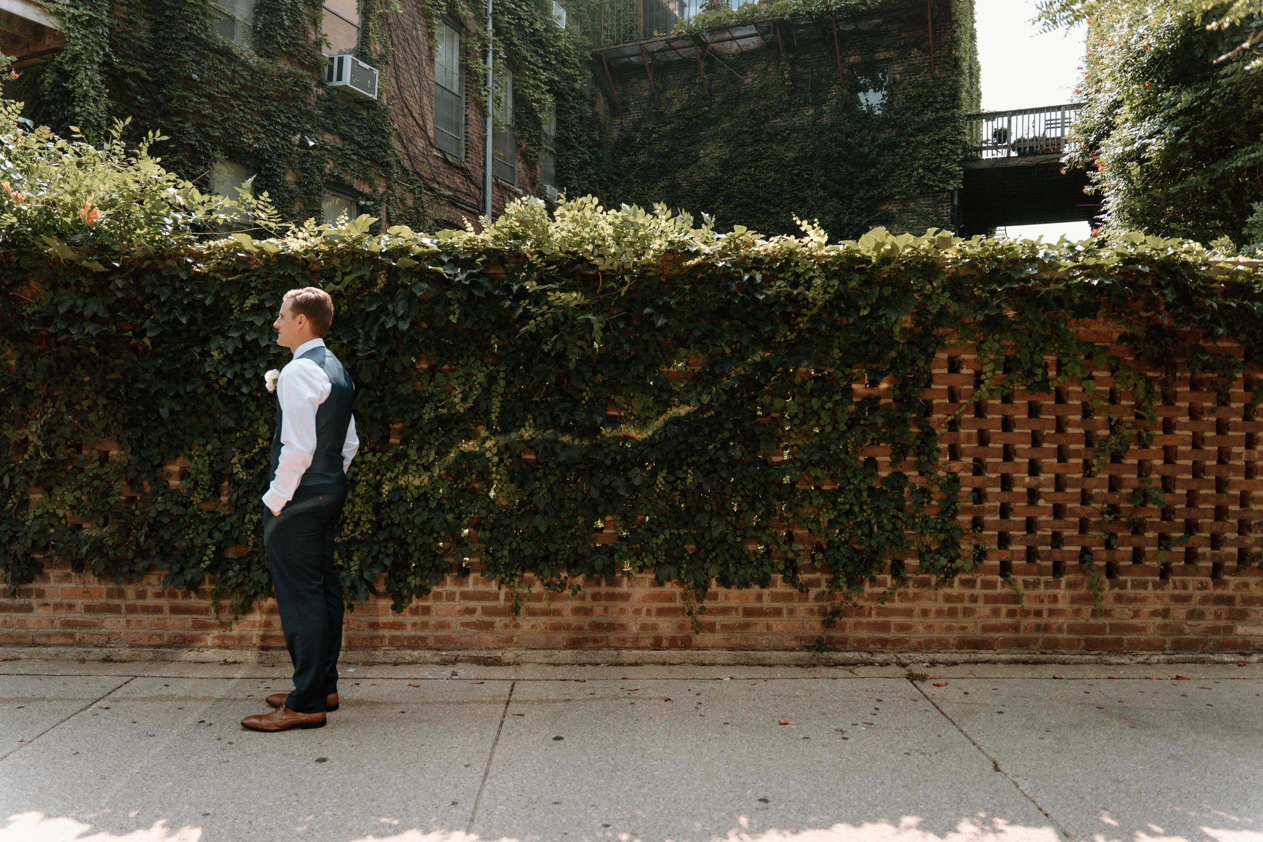 Groom waits for his bride for their first look at their Chicago Wedding Venue
