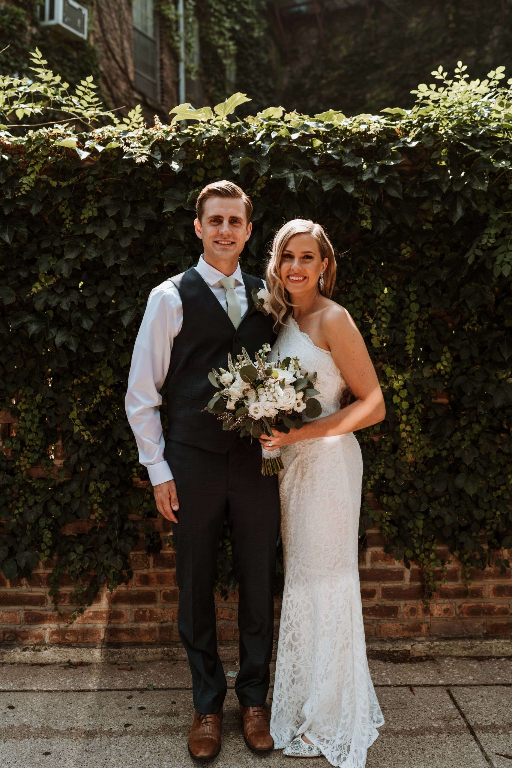 A bride and groom pose together on their wedding day in Chicago