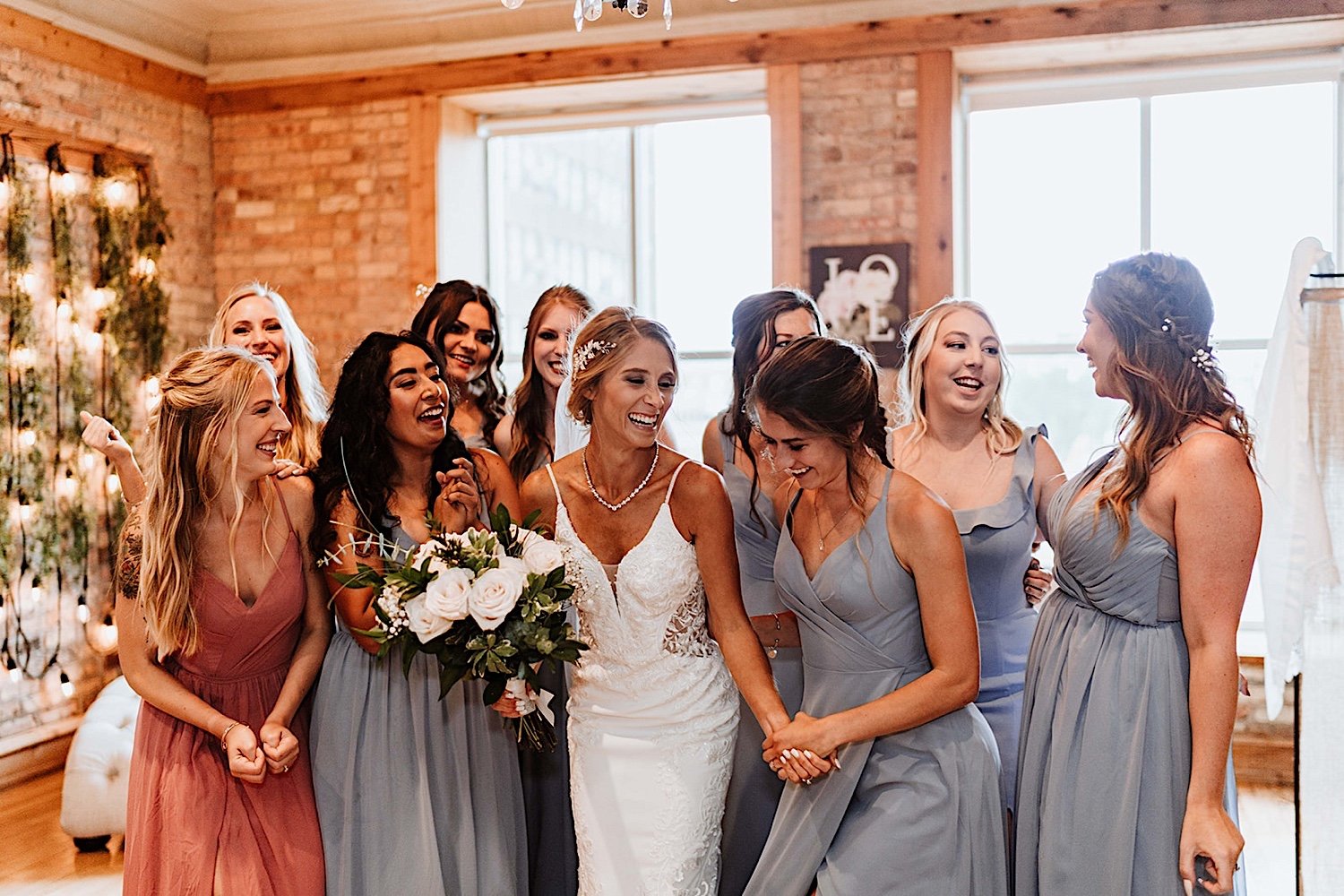 Bridal party getting ready with the bride on her wedding day at Highland Lofts