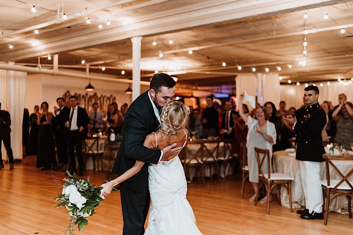Bride and groom kiss when entering their Elgin Wedding reception