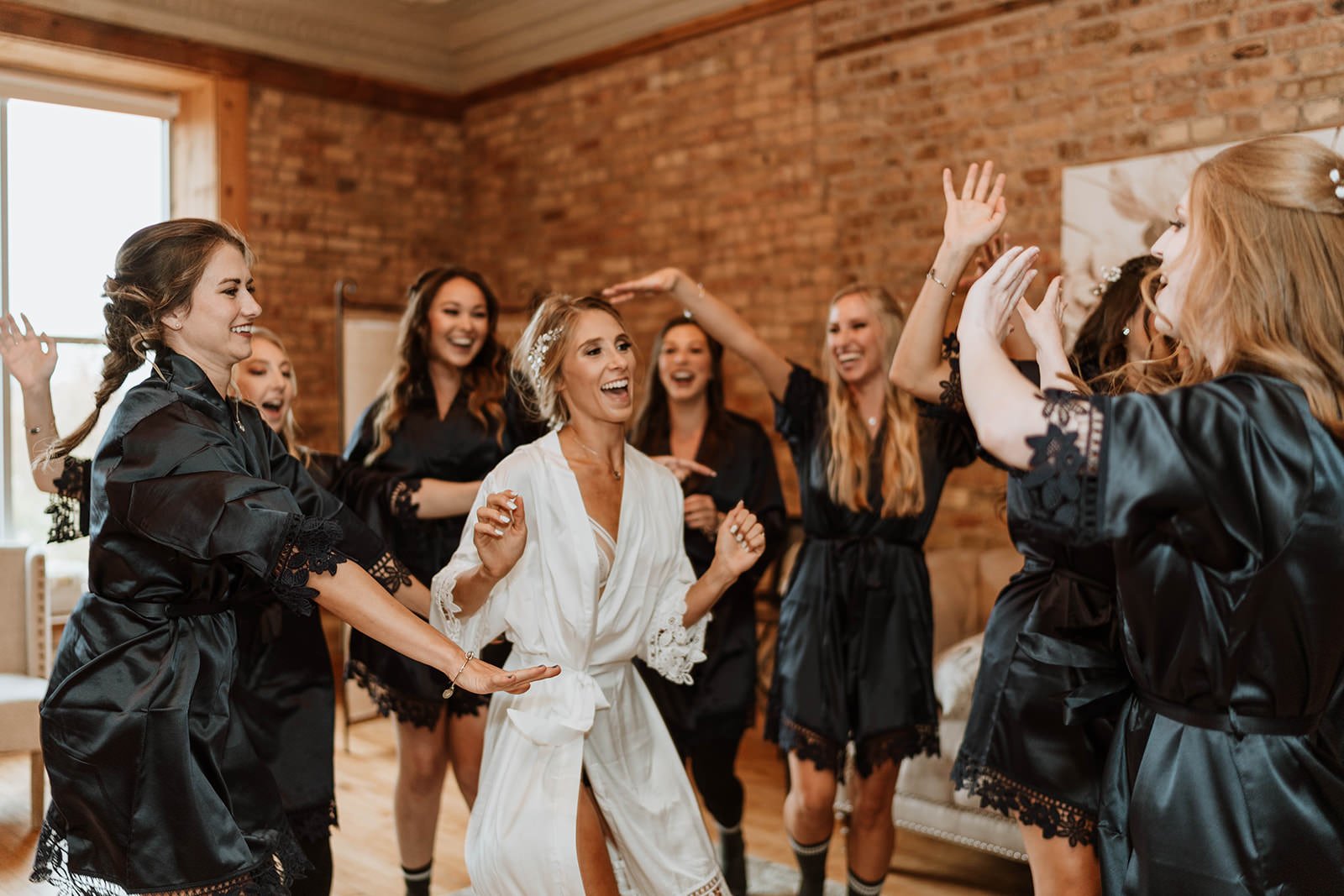 A Bride and her wedding party celebrating before their wedding day at Highland Lofts