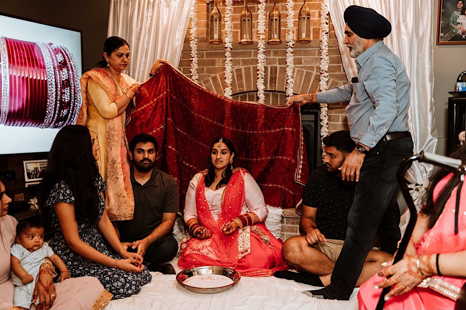Bride takes part in Haldi and Chura as is tradition in Indian Weddings