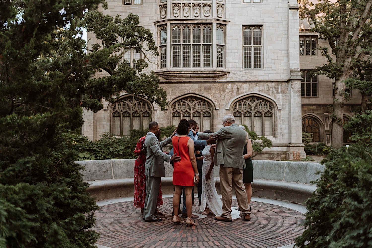 Bride, groom and family share prayer after University of Chicago elopement ceremony