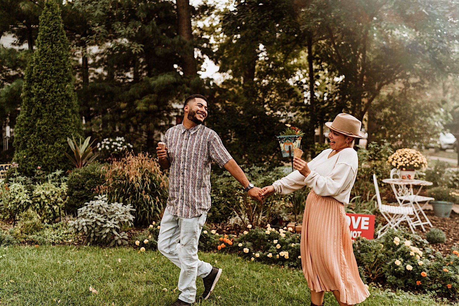 Couple laugh and eat ice cream before surprise proposal
