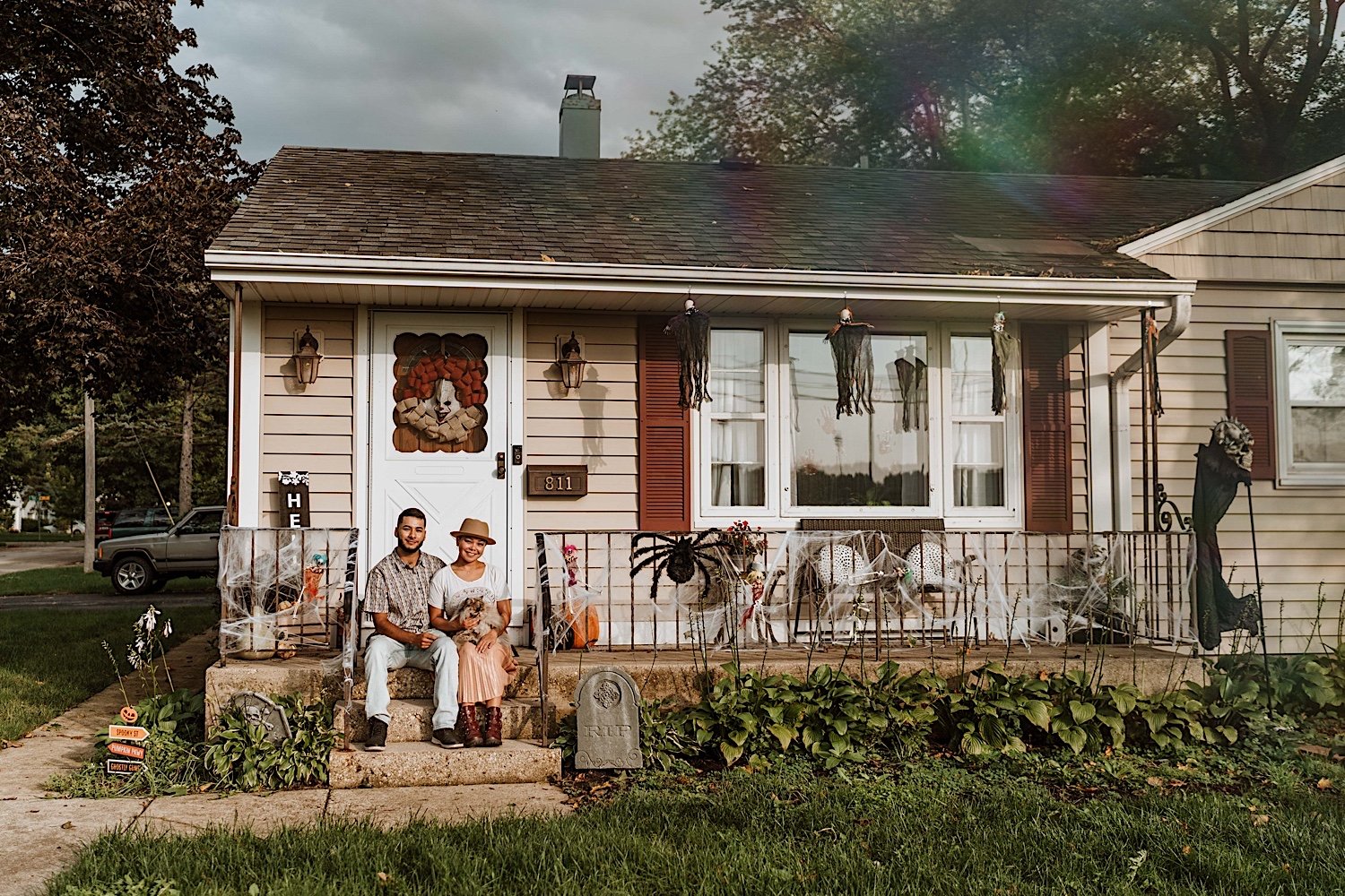 Couple sit on front porch of their house before surprise proposal