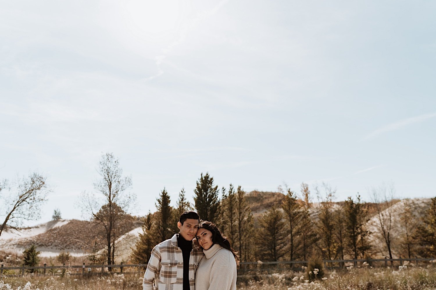 Couple pose in front of Indiana Dunes for anniversary session