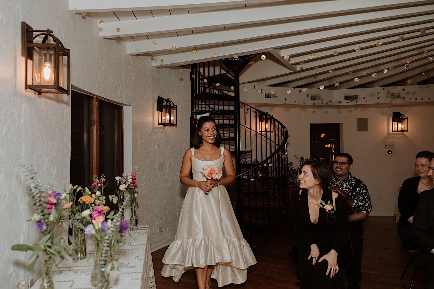 Bride smiling as she enters intimate Indiana wedding reception