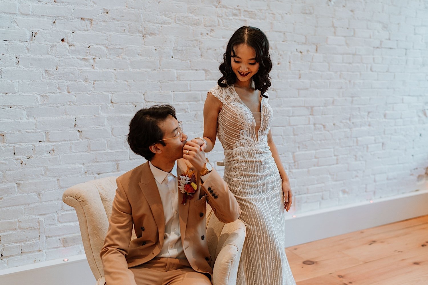 Husband kisses wife's hand during Cincinnati elopement