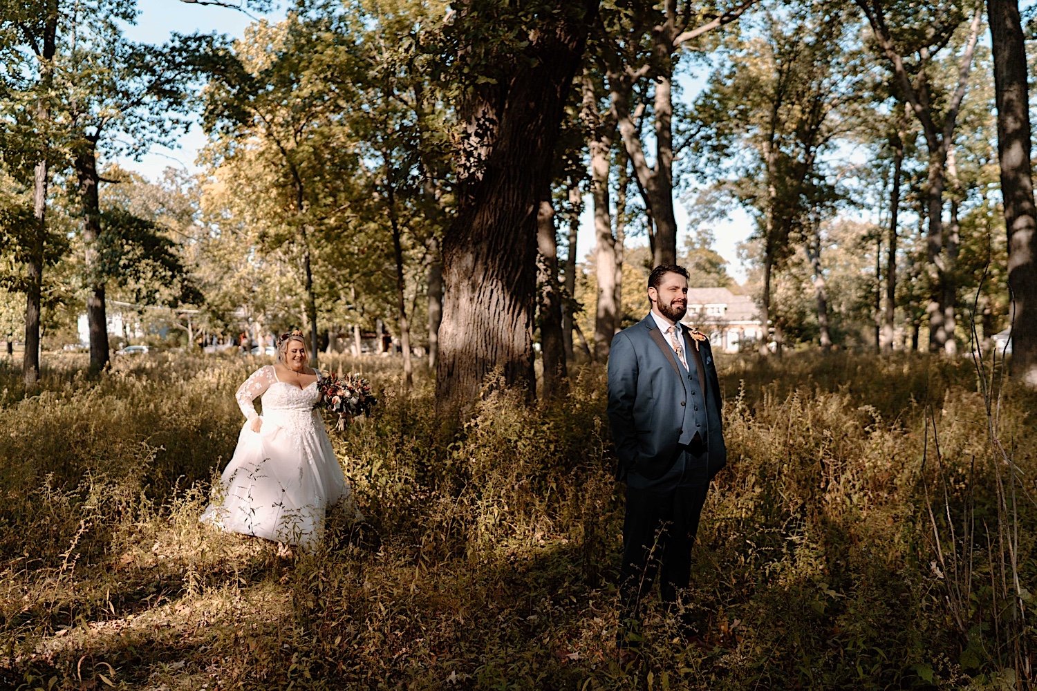 Bride prepares to surprise husband with first look before their Lake Ellyn Boathouse wedding