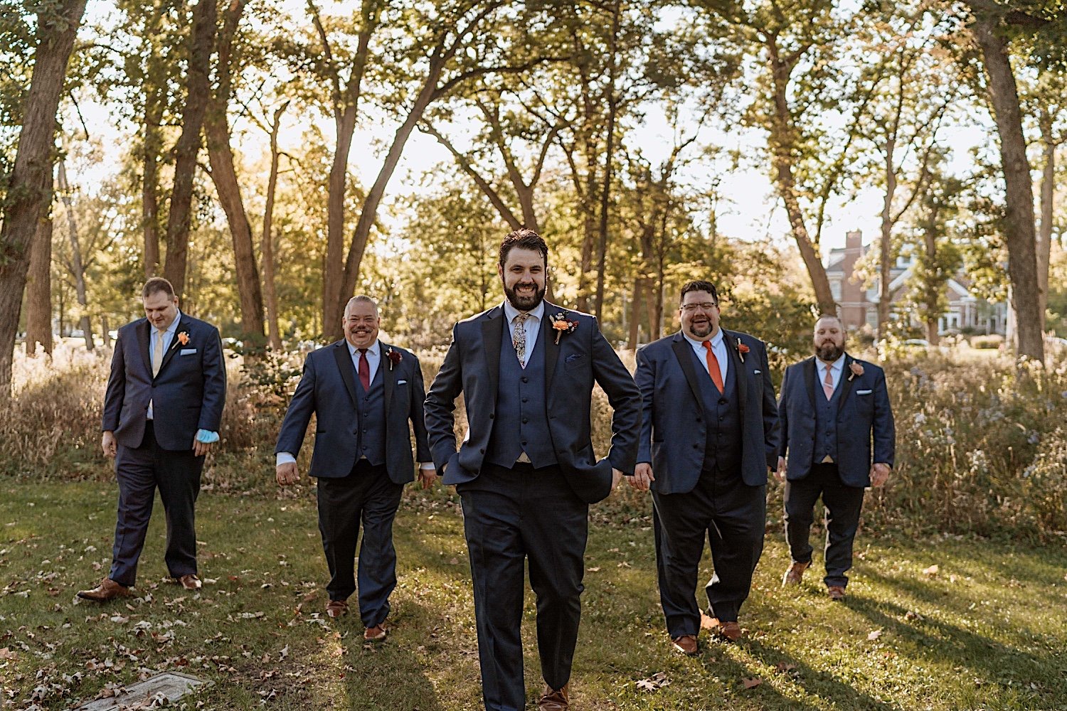 Groom and groomsmen pose before their Lake Ellyn Boathouse wedding