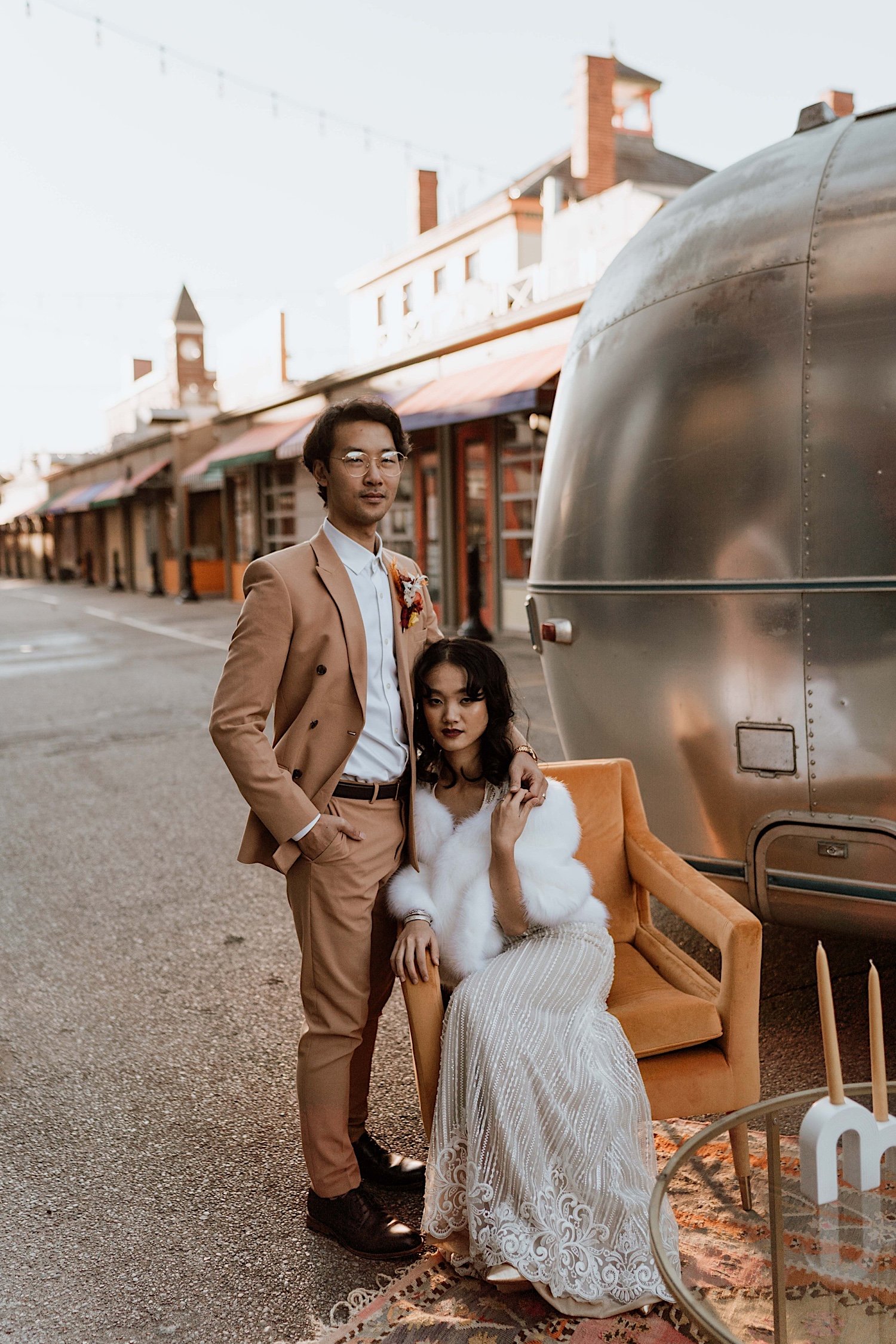 Couple pose next to RV on Cincinnati street during elopment