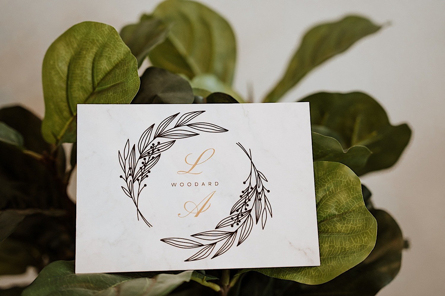 Picture of a wedding invite, reads L Woodard A
