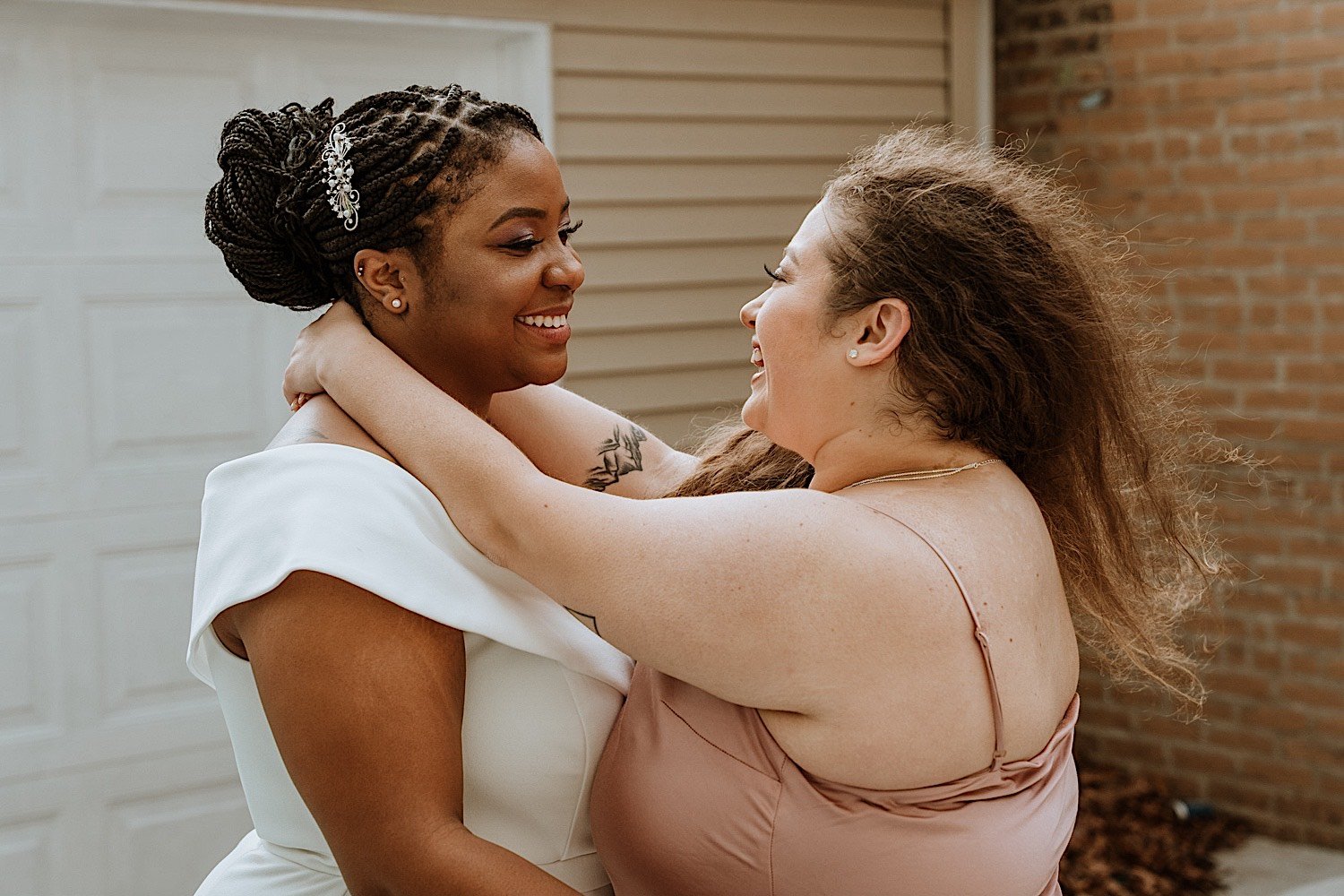 Brides embrace outside their Humboldt Park wedding venue