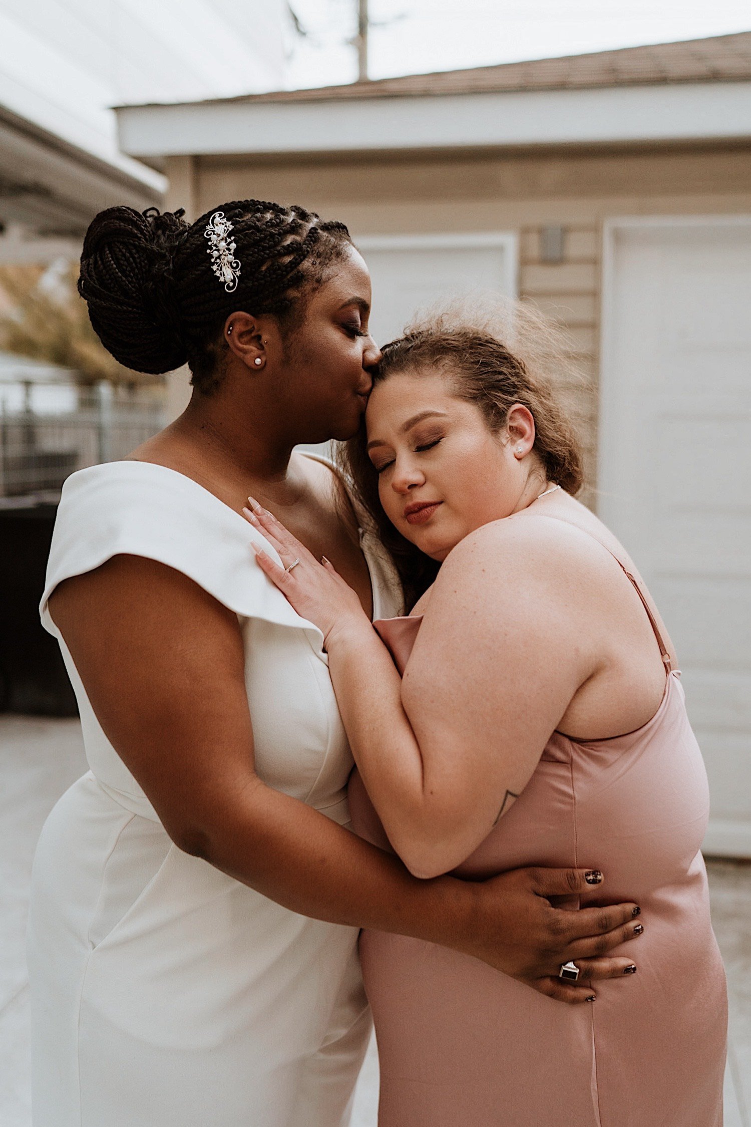 Brides embrace outside their Humboldt Park wedding venue