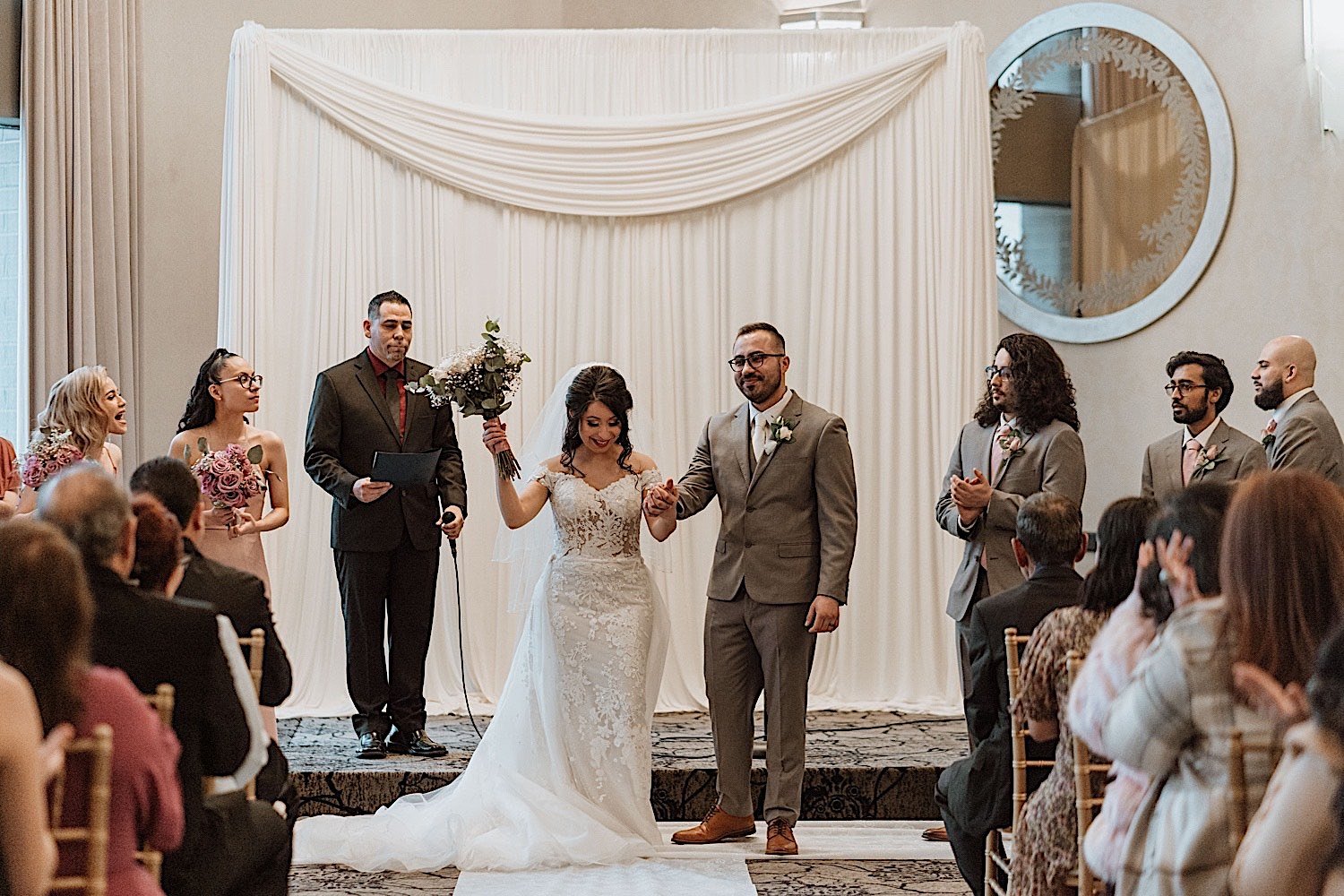 Bride and groom walk down the aisle of their Chicagoland ballroom wedding after officially being married
