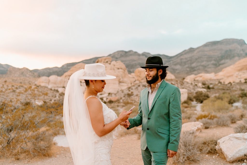 The bride and groom exchanged their vows privately surrounded by the red rocks in Las Vegas.