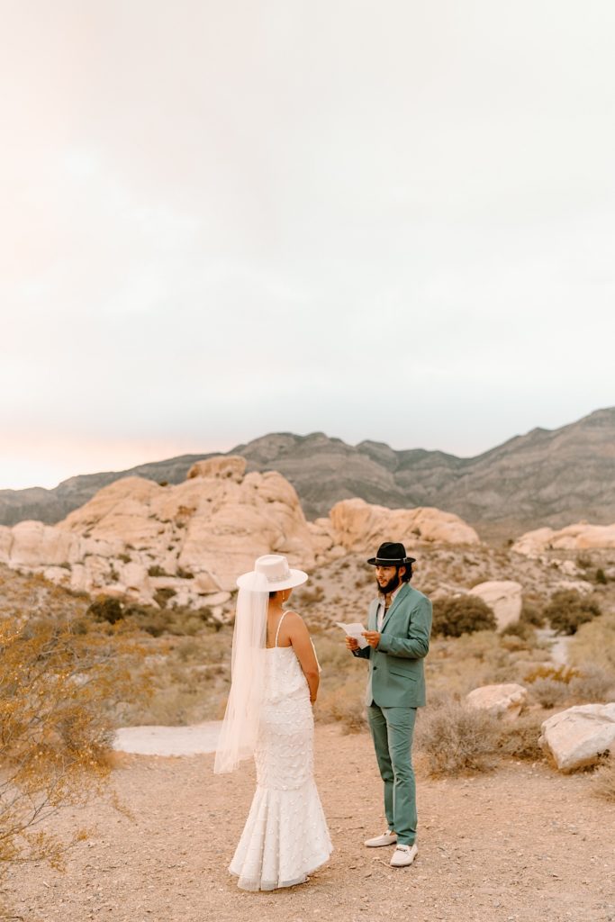 The bride and groom exchanged their vows privately surrounded by the red rocks in Las Vegas.