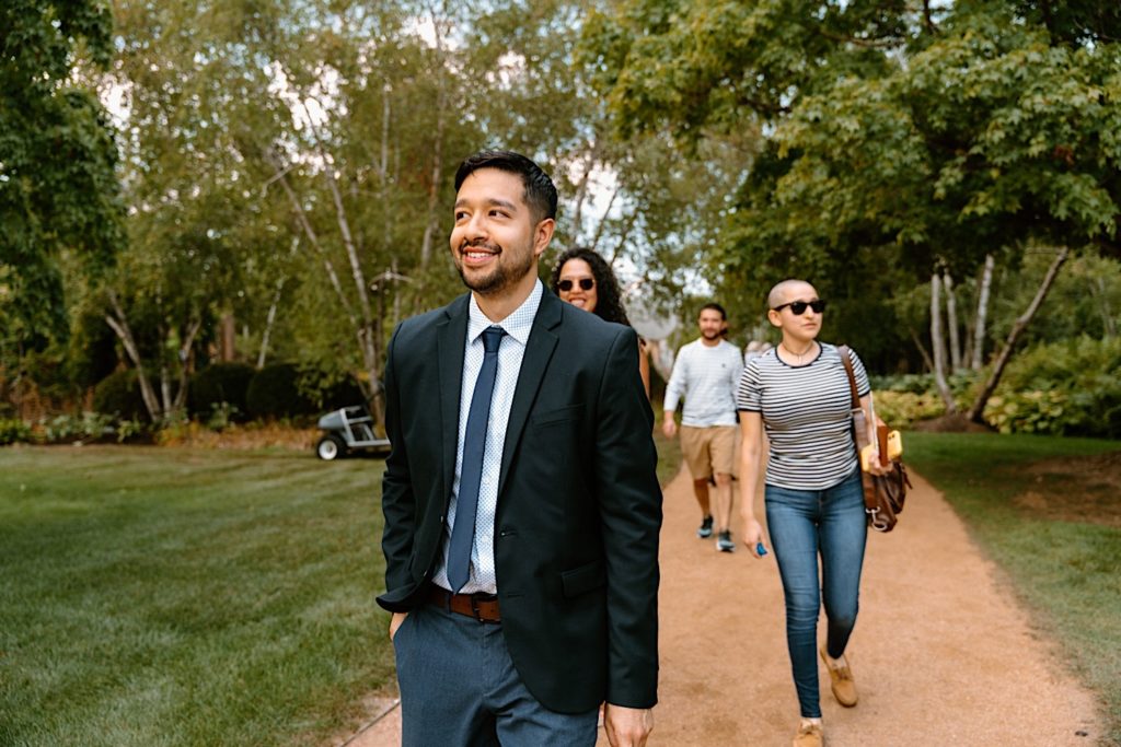 Future fiancé walks to propose to his bride at the Chicago Botanic Gardens.