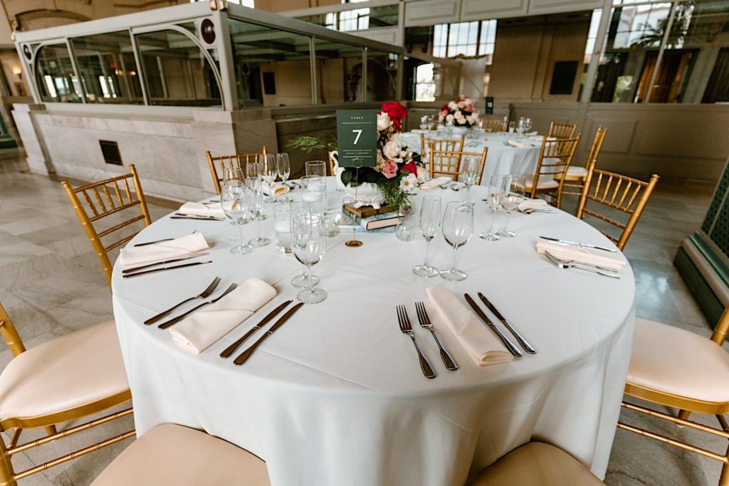 Wedding day table scape with books and flowers at Joliet's Union Station.