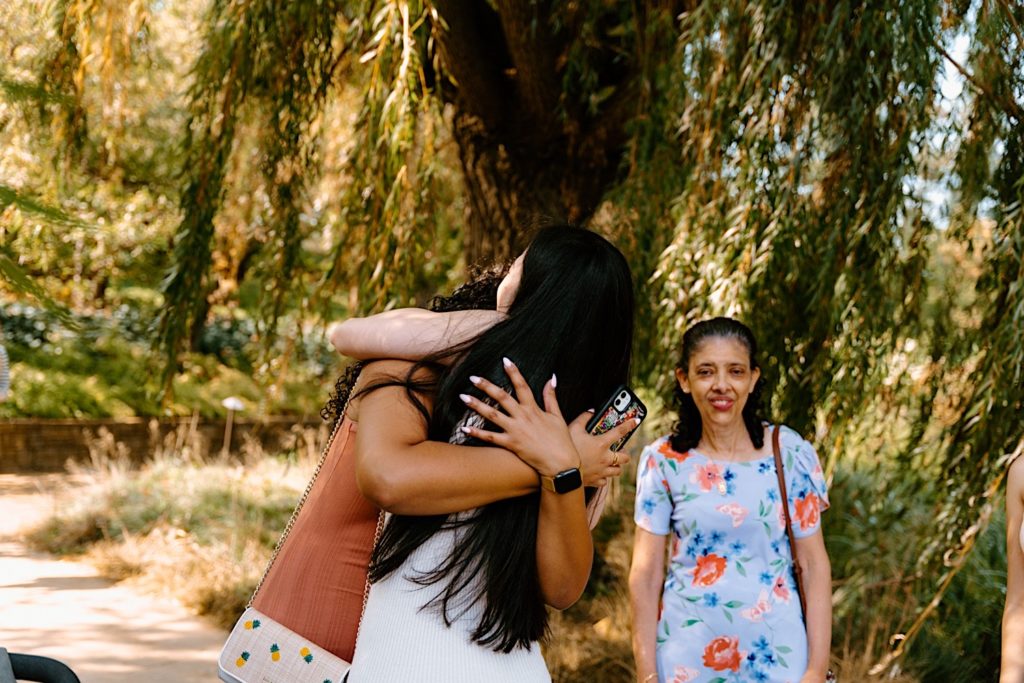 New fiancé holds her family after her partner proposed to her.