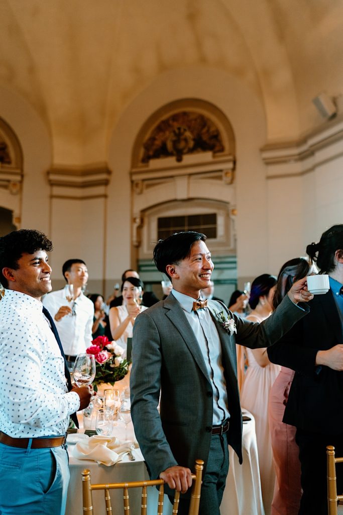 Guests share a toast for the bride and groom at their Joliet Union Station Wedding.