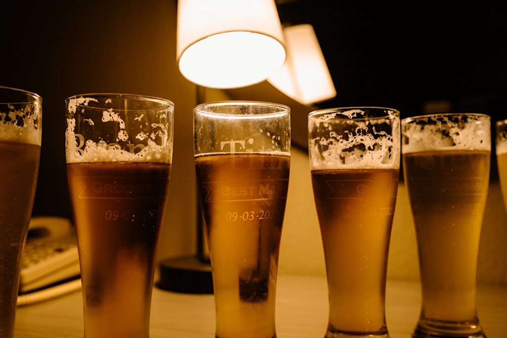 Custom beer glasses with the grooms names and groomsmen's names.