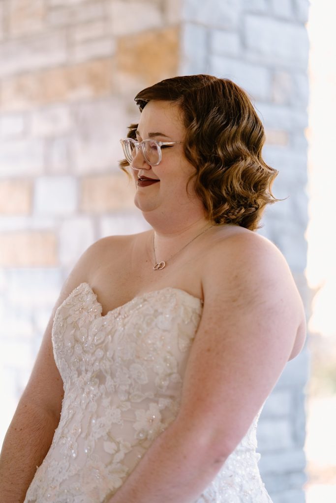 A bride and groom standing at their elopement ceremony at the Grove Redfield Estate.