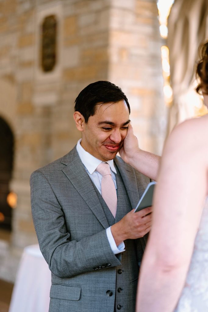 A bride and groom exchange vows at their elopement ceremony at the Grove Redfield Estate.