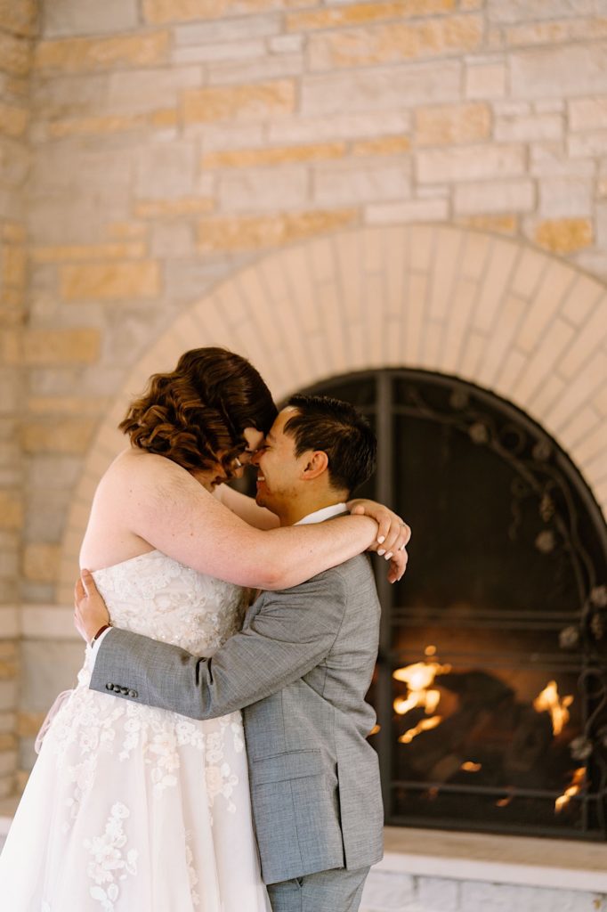 A bride and groom share their first dance under the pavilion at the Grove Redfield Estate