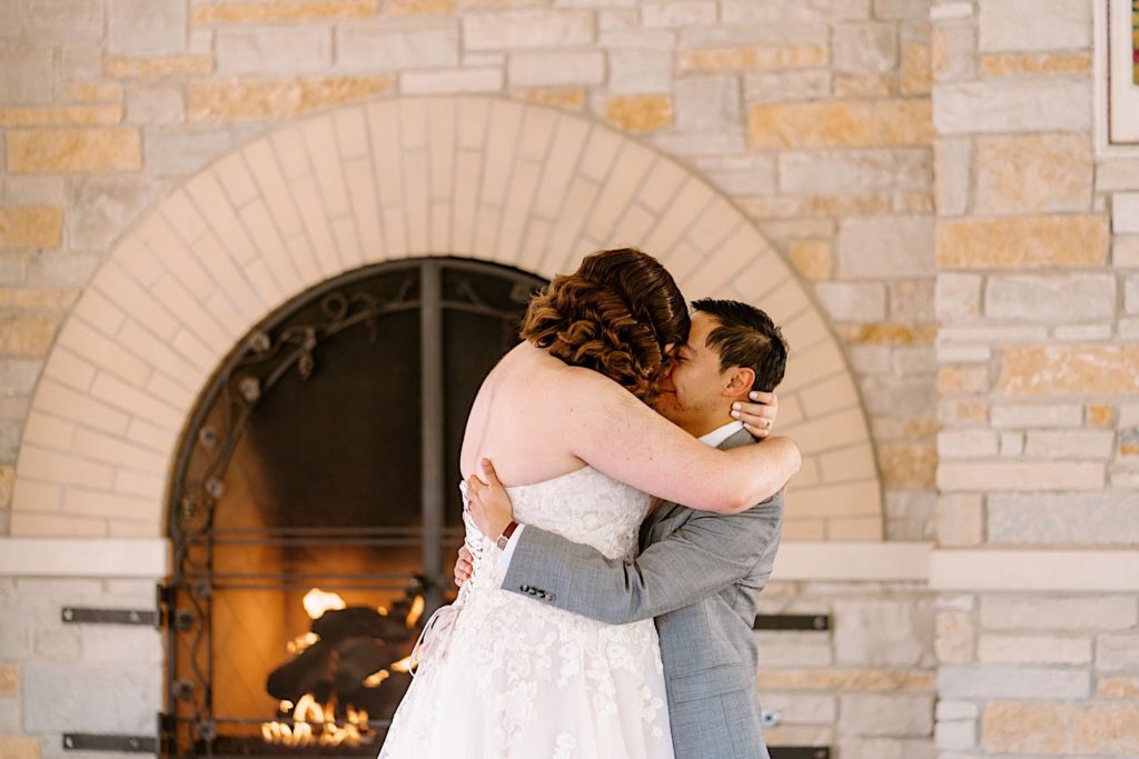 A bride and groom share their first dance under the pavilion at the Grove Redfield Estate