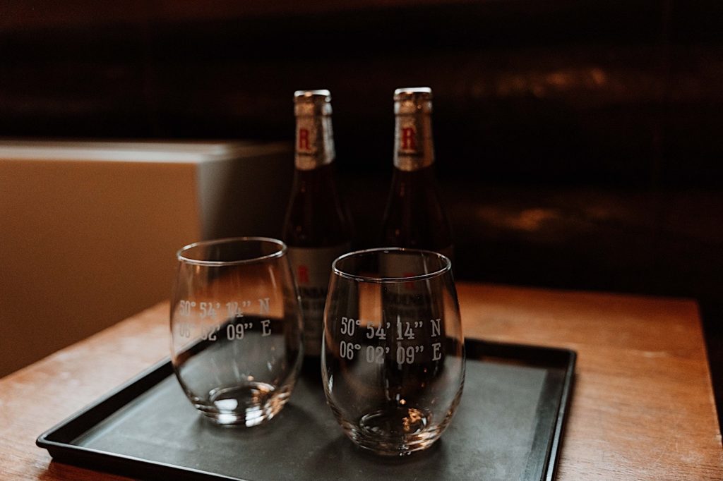 Wine glasses with the coordinates of where a bride and groom met.  Gifted to one another on their wedding day.