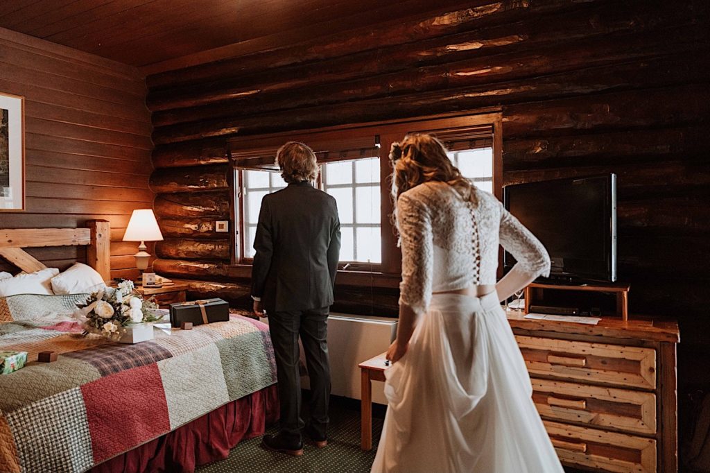 A bride approaches her soon to be husband for the first time on their wedding day.