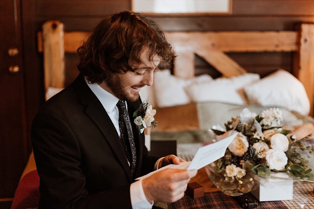 A groom sit reading letters to one another while reading letters from family and friends before they elope at Starved Rock National Park