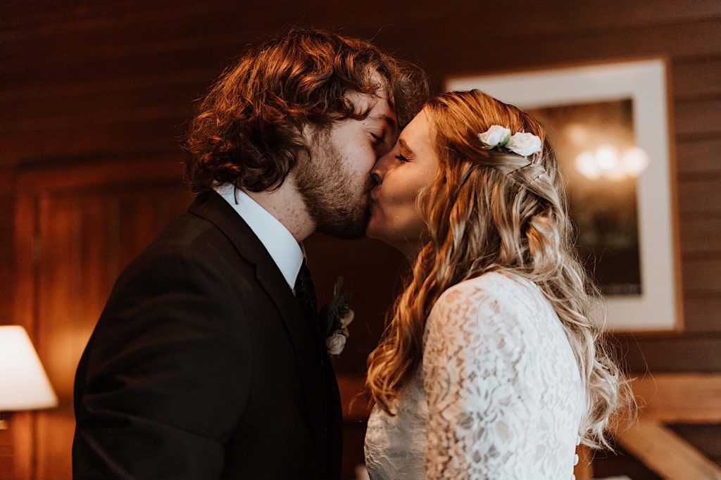 A bride and groom kiss before heading out to Starved Rock to take their wedding portraits.