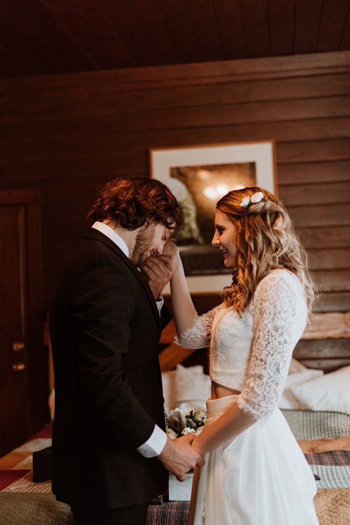 A bride and groom kiss before heading out to Starved Rock to take their wedding portraits.
