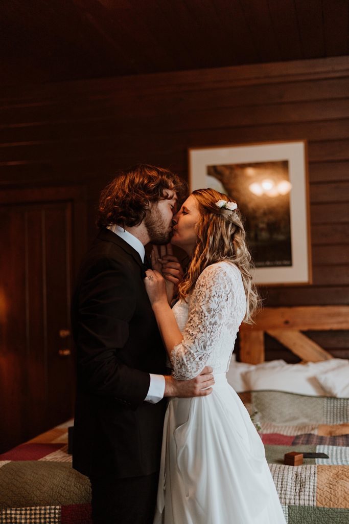 A bride and groom kiss before heading out to Starved Rock to take their wedding portraits.
