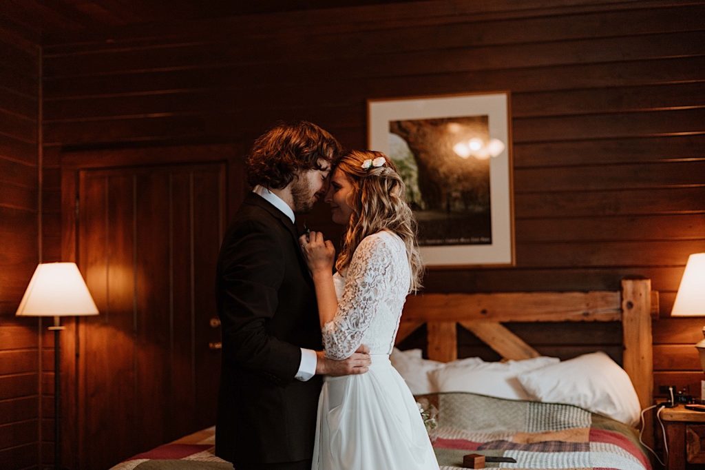 A bride and groom kiss before heading out to Starved Rock to take their wedding portraits.