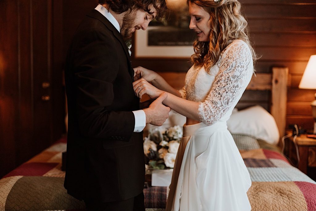 A bride and groom hold hands before heading out to Starved Rock to take their wedding portraits.