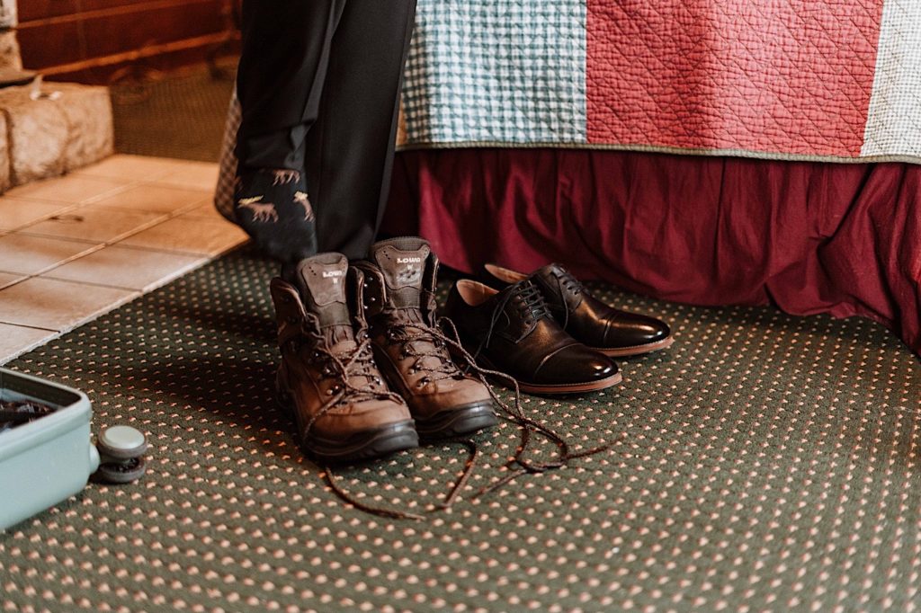 A groom puts on his snow shoes before heading out to take wedding portraits at Starved Rock National Park.