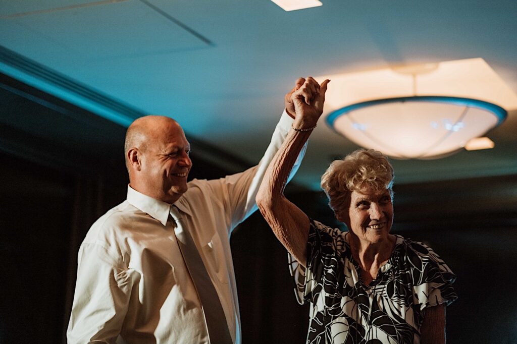 A groom and his mother share a dance during a wedding at the Signature Room on the 95th floor.