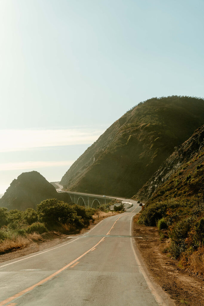 A long and winding road and bridge lining the cliffs of Big Sur National Park