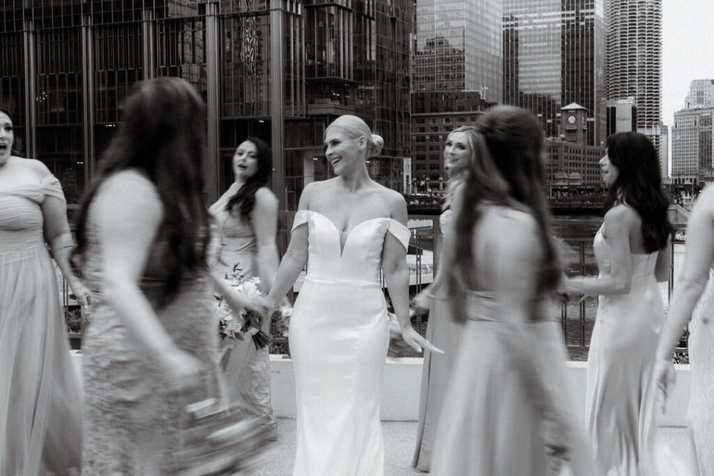 black and white photo of a bride surrounded by her bridesmaids