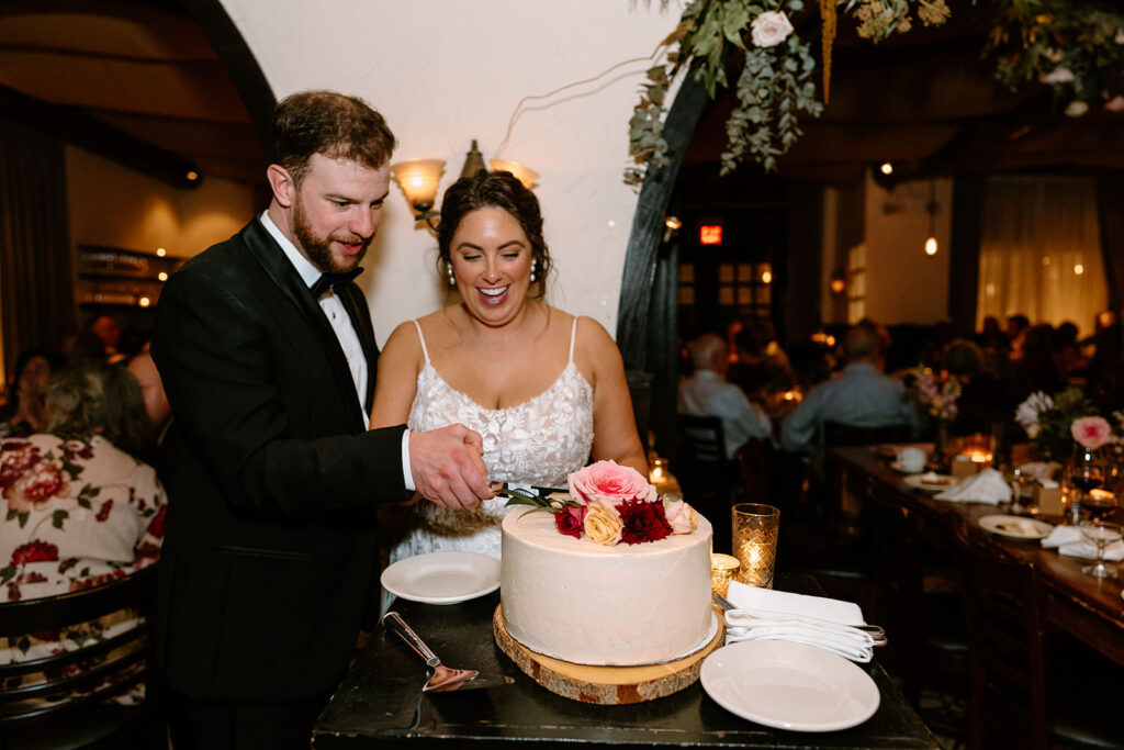 Wedding cake cutting at Osteria Via Stato